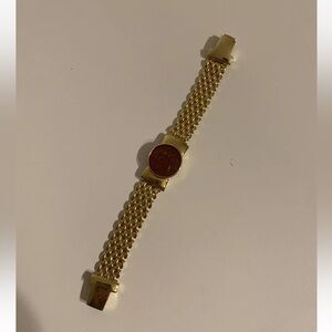 Costume bracelet with red stone in the middle